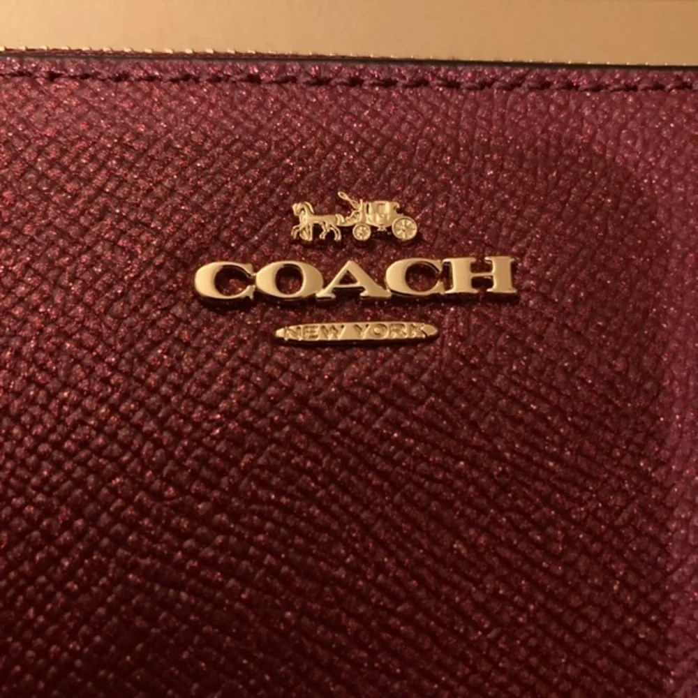 Coach Black Cherry Gift Set with Wristlet and two charms NWT